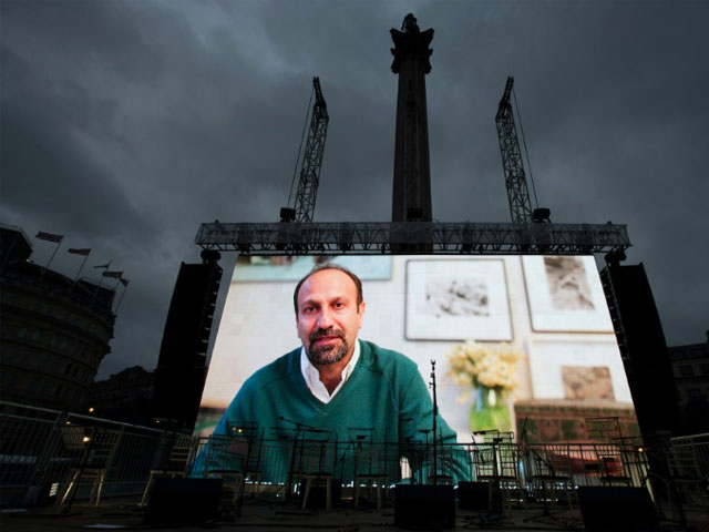 iranian filmmaker asghar farhadi speaks in a recorded video message during the public screening for the film quot the salesman quot in trafalgar square in central london on february 26 2017 afp daniel leal olivas