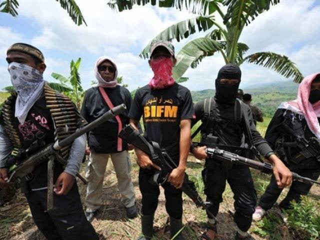 this file photo shows members of a breakaway muslim separatist group stand guard during a clandestine press conference in the town of datu unsay sothern maguindanao province in the philippines on august 28 2011 photo afp this file photo shows members of a breakaway muslim separatist group stand guard during a clandestine press conference in the town of datu unsay sothern maguindanao province in the philippines on august 28 2011 photo afp