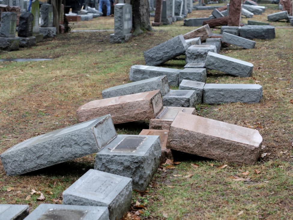 a row of more than 170 toppled jewish headstones is seen after a weekend vandalism attack on chesed shel emeth cemetery in university city a suburb of st louis missouri photo reuters