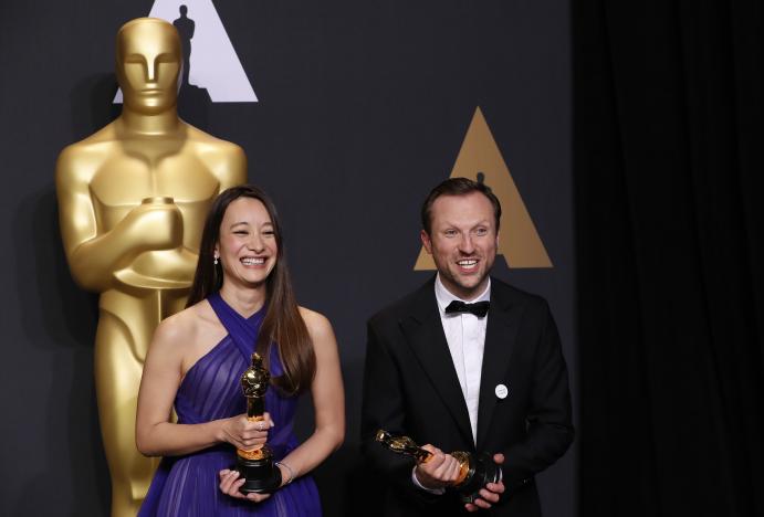 orlando von einsiedel and joanna natasegara hold their oscars for best documentary short subject for quot the white helmets quot photo reuters