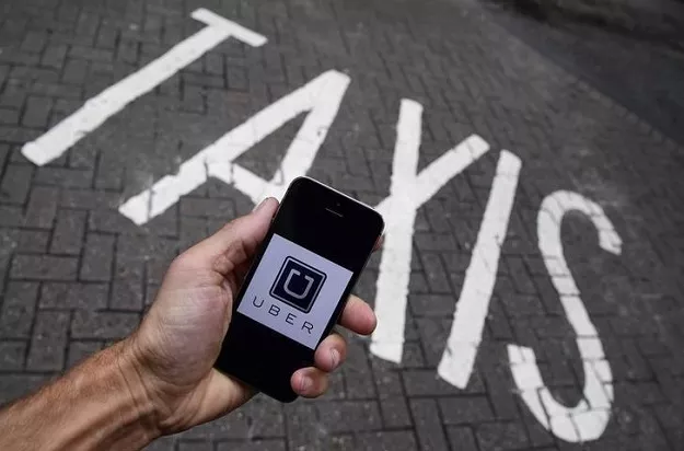 a photo illustration shows the uber app logo displayed on a mobile telephone as it is held up for a posed photograph in central london britain october 28 2016 photo reuters a photo illustration shows the uber app logo displayed on a mobile telephone as it is held up for a posed photograph in central london britain october 28 2016 photo reuters