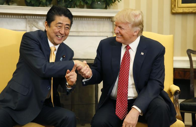 japanese prime minister shinzo abe shakes hands with president donald trump during their meeting in the oval office february 10 2017 photo reuters