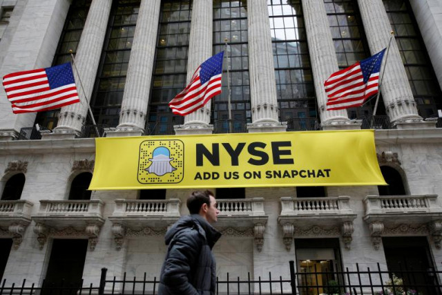 a snapchat sign hangs on the facade of the new york stock exchange nyse in new york city us january 23 2017 photo reuters a snapchat sign hangs on the facade of the new york stock exchange nyse in new york city us january 23 2017 photo reuters