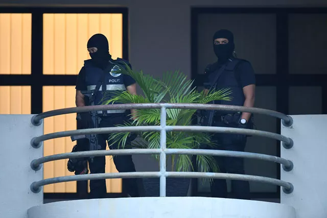 masked malaysian policemen keep watch ahead of the court appearance of indonesian national siti aisyah 25 and vietnamese national doan thi huong 28 at the magistrates 039 court in sepang on march 1 2017 for their alleged role in the assassination of kim jong nam the half brother of north korean leader kim jong un photo afp masked malaysian policemen keep watch ahead of the court appearance of indonesian national siti aisyah 25 and vietnamese national doan thi huong 28 at the magistrates 039 court in sepang on march 1 2017 for their alleged role in the assassination of kim jong nam the half brother of north korean leader kim jong un photo afp