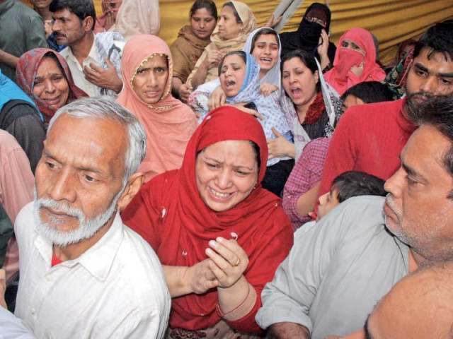 a woman wails outside the house photo abid nawaz a woman wails outside the house photo abid nawaz