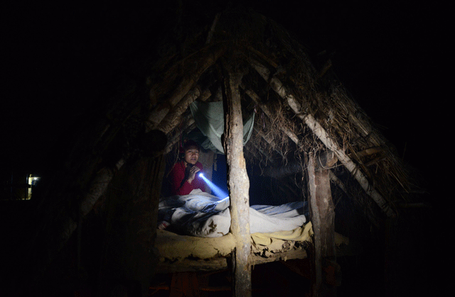 nepalese woman pabitra giri prepares to sleep in a chhaupadi hut during her menstruation period in surkhet district some 520km west of kathmandu february 3 2017 photo afp