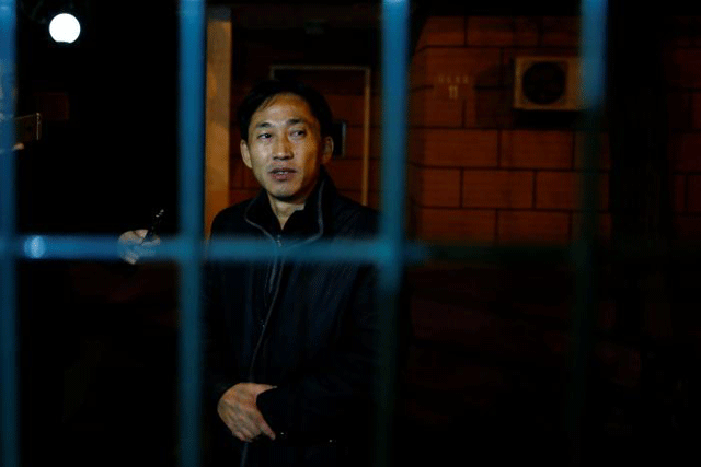 north korean national ri jong chol stands behind the fence of the north korean embassy compound in beijing china march 4 2017 photo reuters