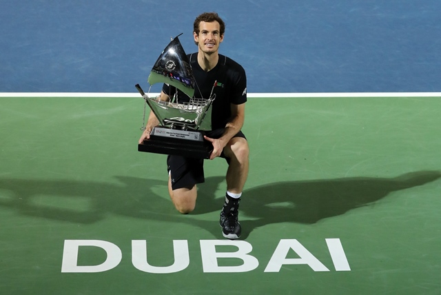 world number one andy murray of great britain celebrates with the championship trophy after winning his atp final tennis match against spain 039 s fernando verdasco during the dubai duty free championships on march 4 2017 photo afp