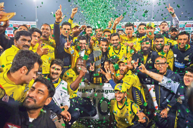 jubilant peshawar zalmi players pose with psl trophy in lahore photo afp jubilant peshawar zalmi players pose with psl trophy in lahore photo afp