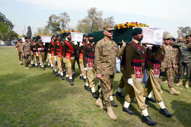 pakistan army personnel carry coffins of five soldiers who were killed during a sunday night militant attack in mohmand agency photo express