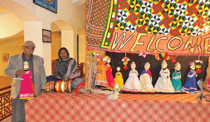 jamil and his wife with their puppets photos express