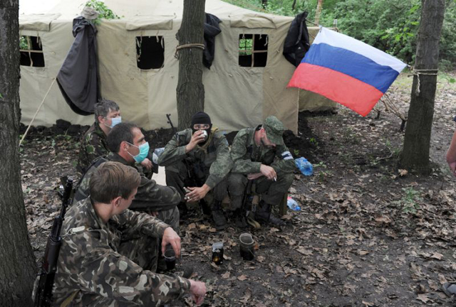 pro russian armed militants of a so called 039 eastern battalion 039 take part in military exercises in the forest near the eastern ukrainian city of donetsk photo afp