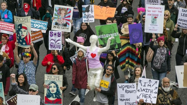 people participate in a march through downtown los angeles honoring international women 039 s day on sunday photo afp people participate in a march through downtown los angeles honoring international women 039 s day on sunday photo afp