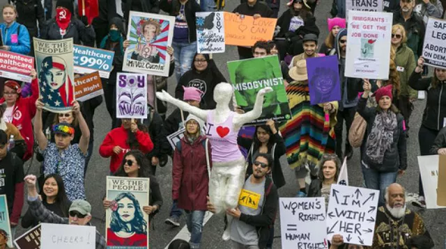 people participate in a march through downtown los angeles honoring international women 039 s day on sunday photo afp people participate in a march through downtown los angeles honoring international women 039 s day on sunday photo afp