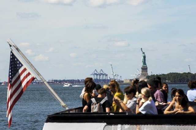 a boatload of tourists stand on a boat as it departs from battery park in new york august 27 2015 photo reuters
