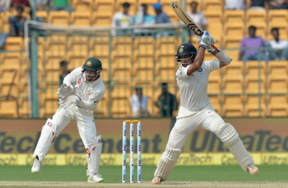 pujara leads india s fightback against australia in second test