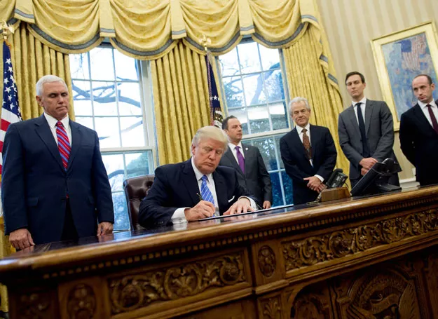 this file photo taken on january 23 2017 shows us president donald trump signing an executive order alongside white house chief of staff reince priebus c us vice president mike pence l national trade council advisor peter navarro 3rd r senior advisor jared kushner 2nd r and senior policy advisor stephen miller in the oval office of the white house in washington dc january 23 2017 photo afp this file photo taken on january 23 2017 shows us president donald trump signing an executive order alongside white house chief of staff reince priebus c us vice president mike pence l national trade council advisor peter navarro 3rd r senior advisor jared kushner 2nd r and senior policy advisor stephen miller in the oval office of the white house in washington dc january 23 2017 photo afp