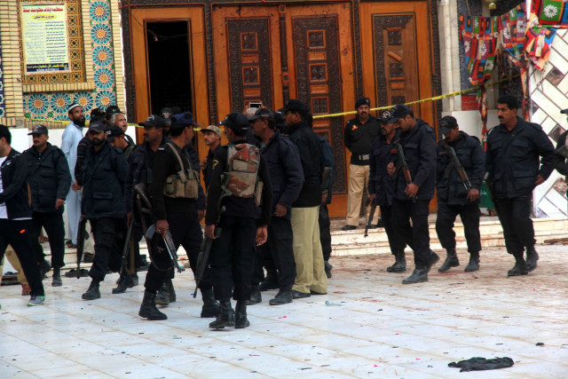 security personnel stand guard at the shrine of lal shahbaz qalandar in sehwan a day after the deadly suicide attack claimed over 90 lives photo athar khan express security personnel stand guard at the shrine of lal shahbaz qalandar in sehwan a day after the deadly suicide attack claimed over 90 lives photo athar khan express