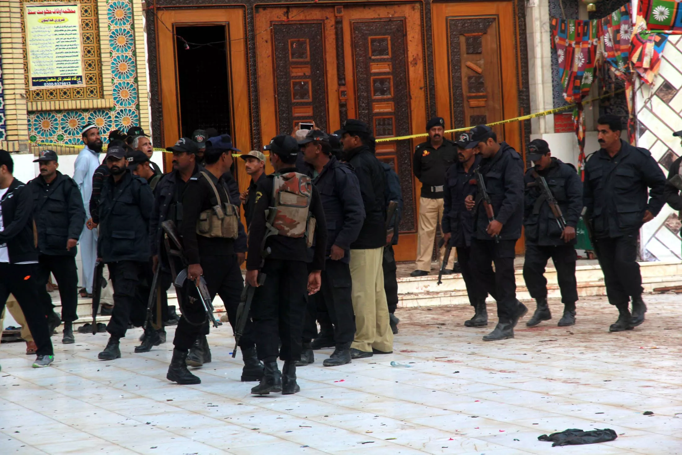 security personnel stand guard at the shrine of lal shahbaz qalandar in sehwan a day after the deadly suicide attack claimed over 90 lives photo athar khan express security personnel stand guard at the shrine of lal shahbaz qalandar in sehwan a day after the deadly suicide attack claimed over 90 lives photo athar khan express
