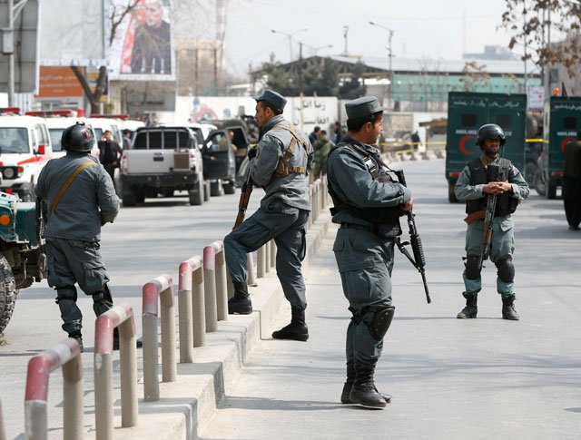 afghan policemen keep watch at the site of a blast and gunfire at a military hospital in kabul afghanistan march 8 2017 photo reuters