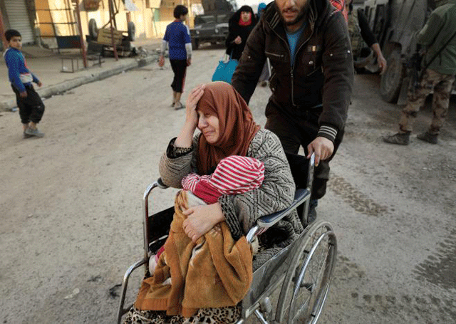 a displaced iraqi woman cries while fleeing her home as iraqi forces battle with islamic state militants in western mosul iraq march 8 2017 photo reuters file