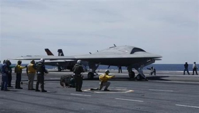 an x 47b pilot less drone combat aircraft is launched for the first time off an aircraft carrier the uss george h w bush in the atlantic ocean off the coast of virginia may 14 2013 reuters jason reed