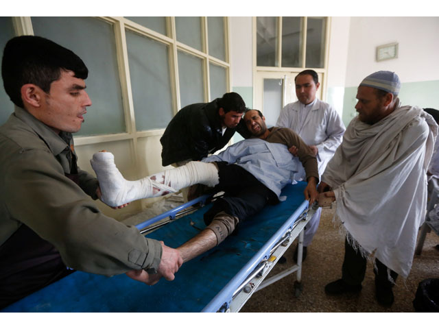 men carry an injured man inside a hospital a day after a bomb blast and gun fire at a military hospital in kabul afghanistan on march 9 2017 photo reuters