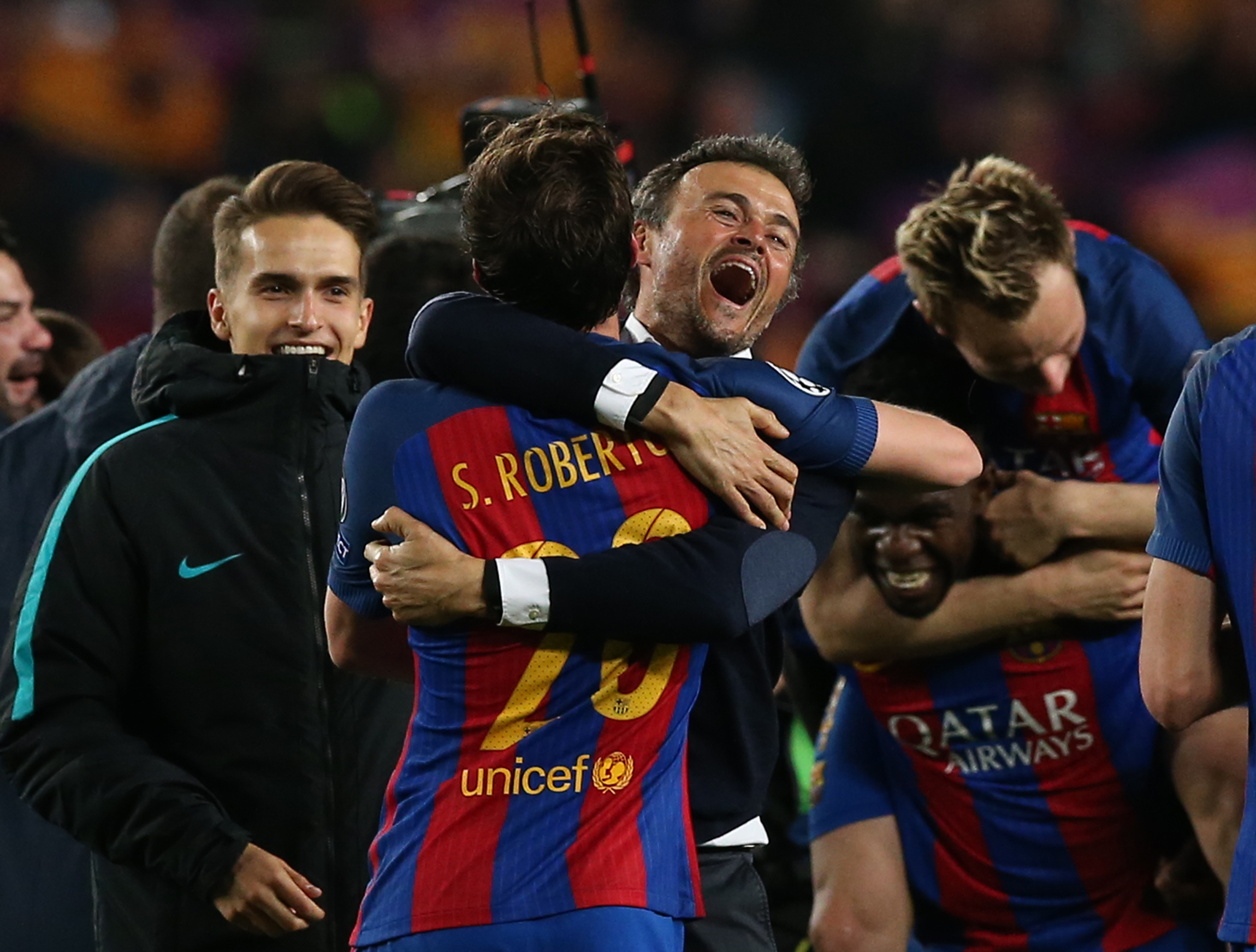 barcelona coach luis enrique and sergi roberto celebrate after the game against psg on march 8 2017 photo reuters