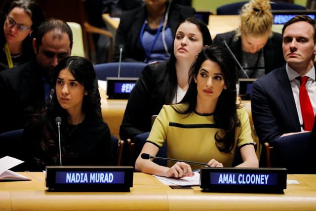 international human rights lawyer amal clooney c sits with nadia murad as she waits to address a bringing da esh to justice event at united nations headquarters in new york photo reuters