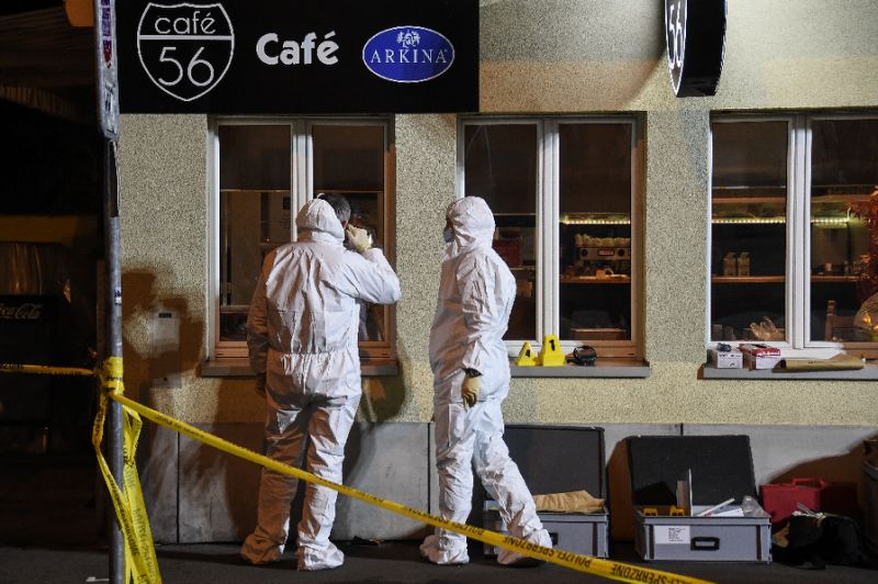 police collect evidence at the site of a shooting on early march 10 2017 in the city of basel north west switzerland photo afp