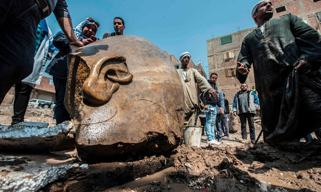 egyptian workers with the head of the statue photo afp egyptian workers with the head of the statue photo afp