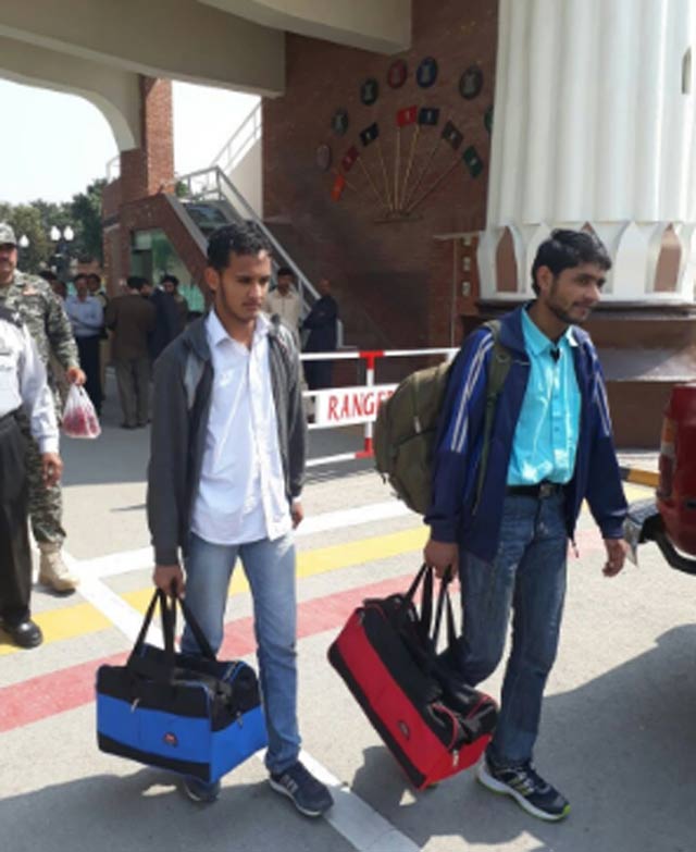 faisal hussain awan and his friend ahsan khursheed were handed over to their families at the wagah border in lahore photo courtesy ani