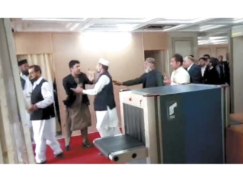 fellow mps try to stop pti s murad saeed during a scuffle with pml n s javed latif photo inp