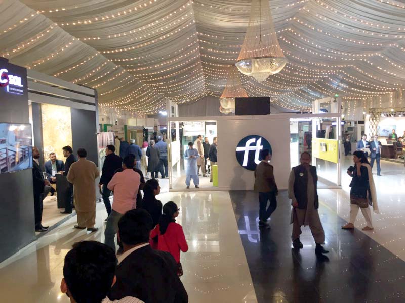 people visit various stalls during an exhibition of builders and architects photo express