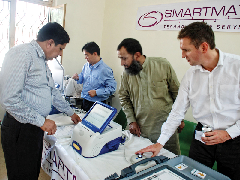 a file photo of a demonstration of an electronic voting machine photo shahid bashir express