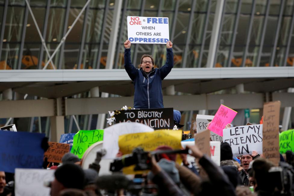a man yells during a protest against donald trump 039 s travel ban outside terminal 4 at john f kennedy international airport in queens photo reuters