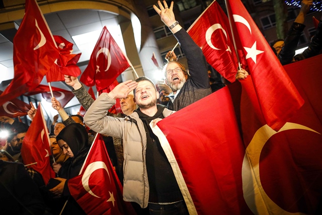 dutch turkish demonstrators hold turkish flags as they gather outside the turkish consulate in rotterdam on march 11 2017 after netherlands refused foreign minister mevlut cavusoglu permission to land for a rally to gather support for a referendum on boosting erdogan 039 s powers photo afp