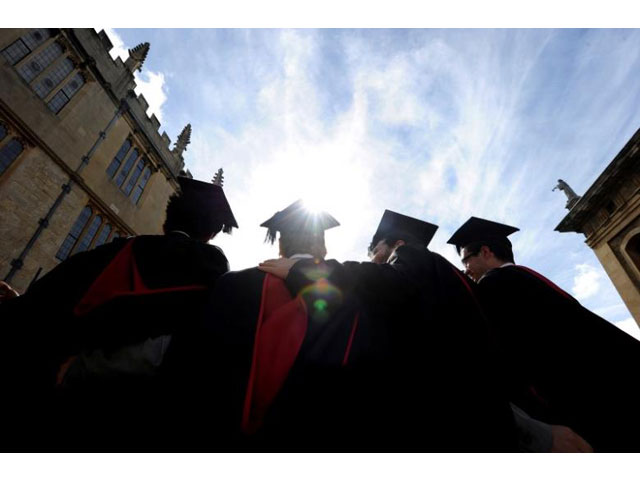 a group of graduates gather outside the sheldonian theatre to have their photograph taken after a graduation ceremony at oxford university oxford england may 28 2011 photo reuters