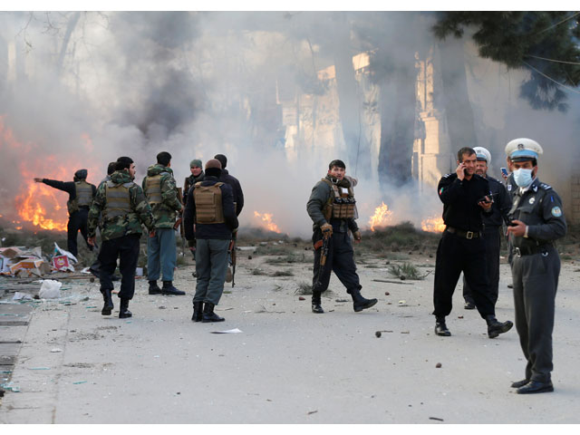 afghan policemen stand guard at the site of a blast in kabul afghanistan march 13 2017 photo reuters