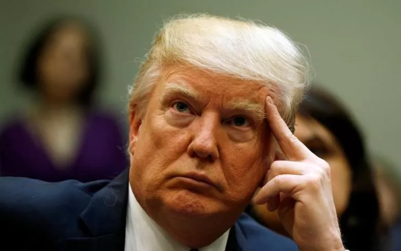 us president donald trump looks up during a meeting about healthcare at the white house in washington u s march 13 2017 photo reuters us president donald trump looks up during a meeting about healthcare at the white house in washington u s march 13 2017 photo reuters