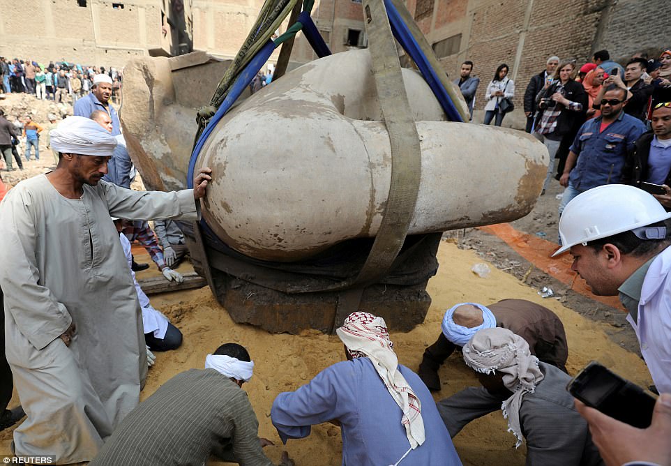 the three tonne torso was pulled by a crane as dozens of workers supported it while being moved to dry land on march 13 2017 photo reuters