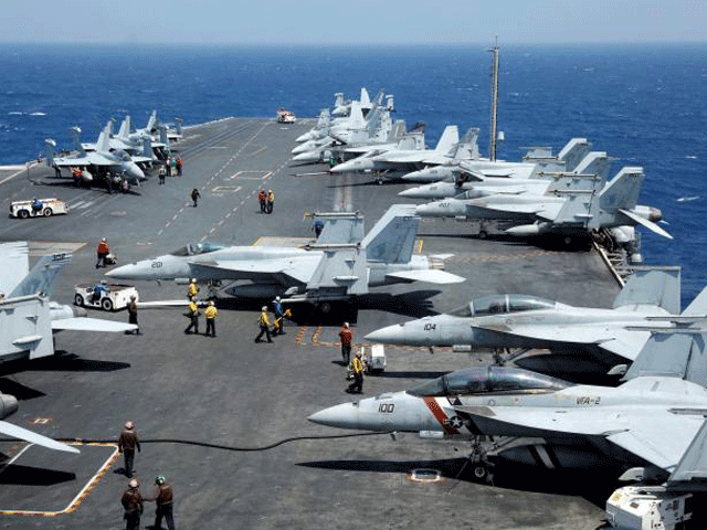 us navy f18 fighter jets are pictured on the flight deck of aircraft carrier uss carl vinson during a routine exercise in south china sea march 3 2017 photo reuters