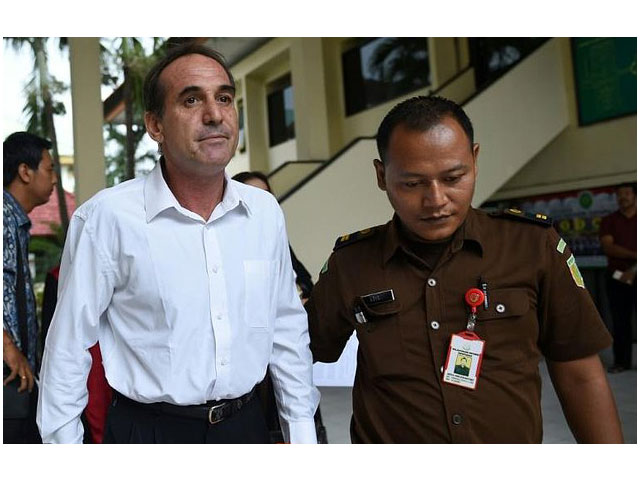 australian businessman giuseppe serafino is taken to a holding cell after his trial at a court in denpasar on indonesia 039 s resort island of bali on march 14 2017 photo afp