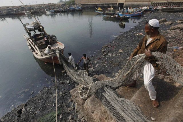 men load fish nets onto a boat before they depart for a catch at the ibrahim hyderi fish harbor some 17 km 11 miles from karachi on december 7 2012 ibrahim hyderi is a town in district malir where most of the bengali and burmese community lives photo reuters men load fish nets onto a boat before they depart for a catch at the ibrahim hyderi fish harbor some 17 km 11 miles from karachi on december 7 2012 ibrahim hyderi is a town in district malir where most of the bengali and burmese community lives photo reuters