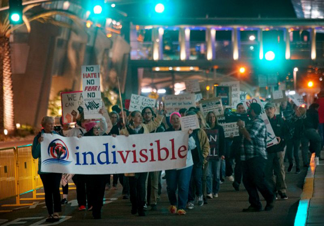 protesters chant during a rally against the travel ban at san diego international airport in california on march 6 2017 after us president donald trump signed a revised ban on refugees and travelers from six muslim majority nations photo afp