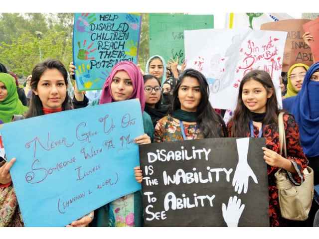 women hold placards at an awareness walk photo express women hold placards at an awareness walk photo express