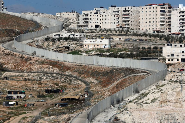 israel 039 s separation barrier dividing east jerusalem l from the west bank village of anata photo afp