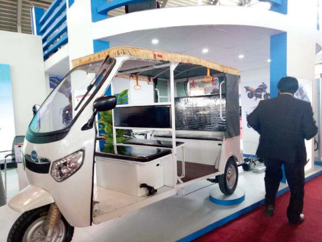 an electronic solar powered rickshaw rick e is on display photo express an electronic solar powered rickshaw rick e is on display photo express