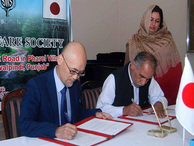junya matsuura charh d affaires ad interim of embassy of japan in pakistan and representative of sanj welfare society sws signing documents during the ceremony photo app junya matsuura charh d affaires ad interim of embassy of japan in pakistan and representative of sanj welfare society sws signing documents during the ceremony photo app