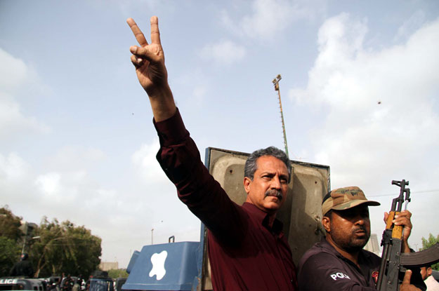 mqm leader waseem akhter makes a victory sign as he is being shifted to karachi central jail on tuesday photo ppi